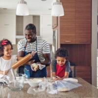 Father cooking with kids